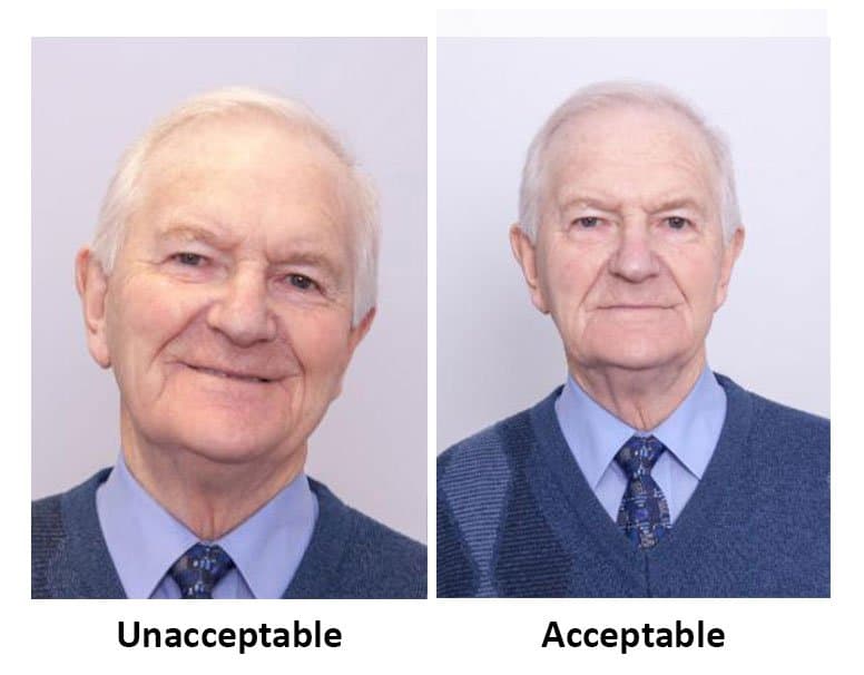 Smiling portrait marked unacceptable beside neutral expression acceptable for Irish passport (Ireland — Ireland Passport Photo ID photo guide)
