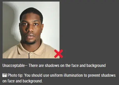Passport photo example with strong shadows on the face or background (China (中国) — Visa (2x2 inch) ID photo guide)